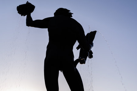 GOTHENBURG, SWEDEN - JULY 9, 2014: Silhouette of the statue of Poseidon by Carl Milles, inaugurated in 1931, in Gothenburg, Swedenのeditorial素材