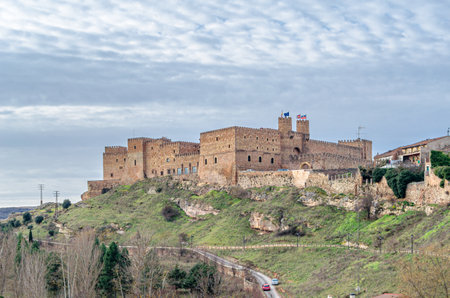 SIGUENZA, SPAIN - DECEMBER 27, 2014: View of the village of Siguenza, Guadalajara province, Castilla la Mancha, Spain, with the medieval Castle of the Bishops of Siguenza in the background, which today is the parador (luxury hotel)のeditorial素材