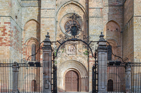 The Cathedral of Santa Maria in Siguenza, built between 1144-1326, Guadalajara province, Castilla la Mancha, Spain. View of the Romanesque main facade, with subsequent Neoclassical and Baroque additionsの写真素材