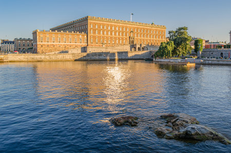 STOCKHOLM, SWEDEN - JULY 25, 2014: View of the Stockholm Palace (Royal Palace) on the waterfront during sunset, built between 1697-1760 in Baroque styleのeditorial素材