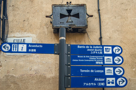 SEGOVIA, SPAIN - DECEMBER 22, 2019: Sign with directions to the main tourist attractions in the city of Segovia, Castile and Leon, Spainのeditorial素材