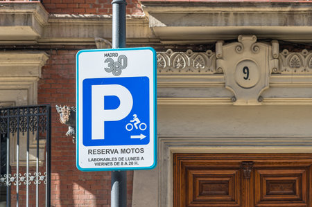 MADRID, SPAIN - NOVEMBER 6, 2022: Traffic sign in downtown Madrid, Spain, indicating reserved space for motorcycles and time restrictionのeditorial素材