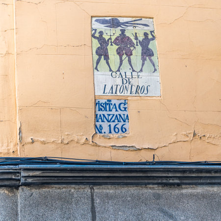 MADRID, SPAIN - NOVEMBER 10, 2022: Beautiful tiled street signs in Madrid, designed in the 90's by ceramic artist Alfredo Ruiz de Lunaのeditorial素材