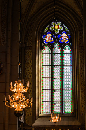 UPPSALA, SWEDEN - JULY 26, 2014: Detail of stained glass inside Uppsala Cathedral, a Gothic Lutheran church in the city of Uppsala, Sweden, inaugurated in 1435のeditorial素材