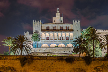 PALMA, SPAIN - JANUARY 11, 2015: Night view of the Royal Palace of La Almudaina, the royal palace or royal fortress of Palma, Majorca, Balearic Islands, Spain. It is one of the official residences of the Spanish royal familyのeditorial素材