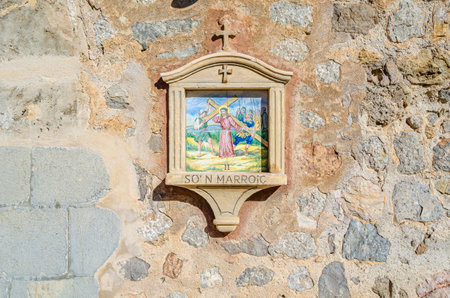 DEIA, SPAIN - JANUARY 10, 2015: Path to the cemetery of the village of Deia, Mallorca, Balearic Islands, Spain, lined with small chapels with scenes from the Stations of the Cross (Via Crucis). Each station was donated and has been maintained by a local fのeditorial素材