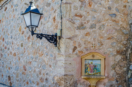 DEIA, SPAIN - JANUARY 10, 2015: Path to the cemetery of the village of Deia, Mallorca, Balearic Islands, Spain, lined with small chapels with scenes from the Stations of the Cross (Via Crucis). Each station was donated and has been maintained by a local fのeditorial素材