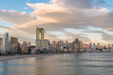 Sunset view of modern buildings in front of Poniente Beach in Benidorm, Alicante province, Valencian Community, Spainの写真素材