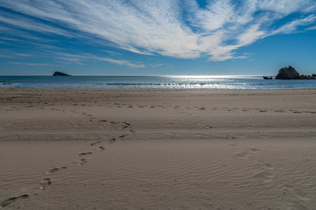 View of the Mediterranean Sea from Cala de Finestrat beach, with Benidorm Island in the background, Alicante province, Valencian Community, Spainの写真素材