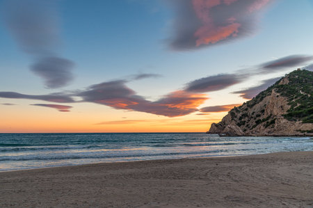 View of the beach of Cala de Finestrat at sunset, Alicante province, Valencian Community, Spainの写真素材