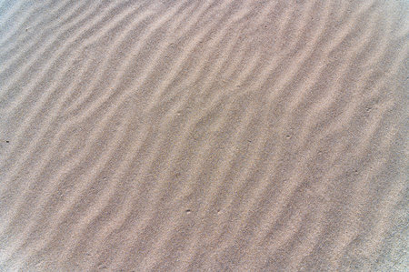 Detail of the pattern in the sand of a beachの写真素材