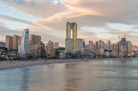 Sunset view of modern buildings in front of Poniente Beach in Benidorm, Alicante province, Valencian Community, Spainの写真素材
