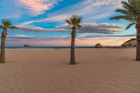 View of the beach of Cala de Finestrat at sunset, Alicante province, Valencian Community, Spainの写真素材