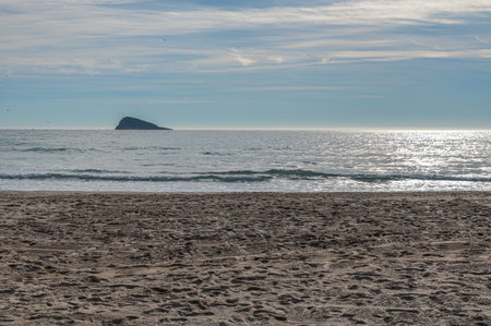View of the Mediterranean Sea from Cala de Finestrat beach, with Benidorm Island in the background, Alicante province, Valencian Community, Spainの写真素材