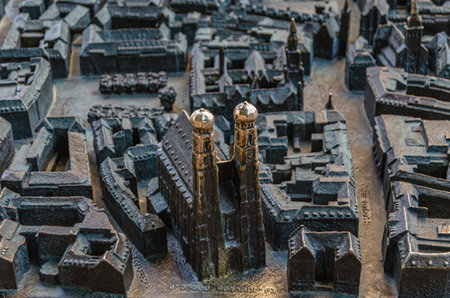MUNCHEN, GERMANY - JULY 3, 2015: Bronze model of Munich city center made by Egbert Broerken (2004) stands on Frauenplatz in front of the Frauenkirche (Cathedral of Our Lady)のeditorial素材
