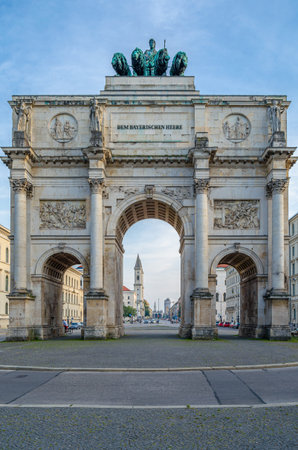 MUNCHEN, GERMANY - JULY 4, 2015: The Siegestor (Victory Gate) in Munich, Germany, memorial arch designed by Friedrich von Gartner, completed by Eduard Mezger (1852), crowned with a statue of Bavaria with a lion-quadriga sculpted by Johann Martin von Wagneのeditorial素材
