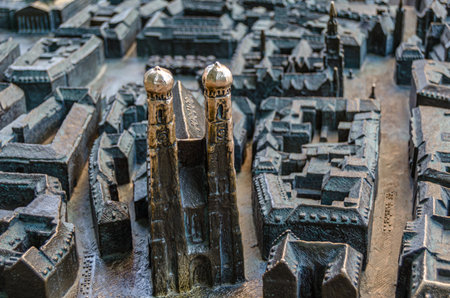 MUNCHEN, GERMANY - JULY 3, 2015: Bronze model of Munich city center made by Egbert Broerken (2004) stands on Frauenplatz in front of the Frauenkirche (Cathedral of Our Lady)のeditorial素材