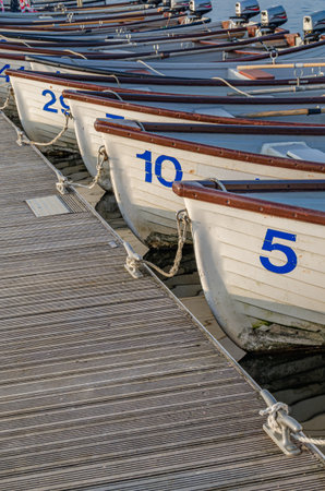 NORMANTON, UNITED KINGDOM - MARCH 20, 2015: Small wooden boats on Rutland Water, a reservoir in Rutland, England, UKのeditorial素材