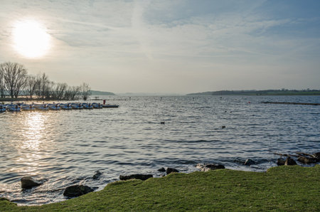 NORMANTON, UNITED KINGDOM - MARCH 20, 2015: Small wooden boats on Rutland Water, a reservoir in Rutland, England, UKのeditorial素材