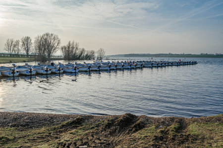 NORMANTON, UNITED KINGDOM - MARCH 20, 2015: Small wooden boats on Rutland Water, a reservoir in Rutland, England, UKのeditorial素材