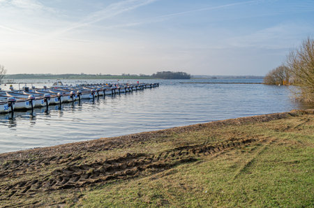 NORMANTON, UNITED KINGDOM - MARCH 20, 2015: Small wooden boats on Rutland Water, a reservoir in Rutland, England, UKのeditorial素材