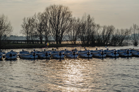 NORMANTON, UNITED KINGDOM - MARCH 20, 2015: Small wooden boats on Rutland Water, a reservoir in Rutland, England, UKのeditorial素材