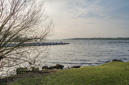 NORMANTON, UNITED KINGDOM - MARCH 20, 2015: Small wooden boats on Rutland Water, a reservoir in Rutland, England, UKのeditorial素材