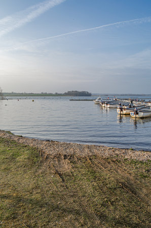 NORMANTON, UNITED KINGDOM - MARCH 20, 2015: Small wooden boats on Rutland Water, a reservoir in Rutland, England, UKのeditorial素材