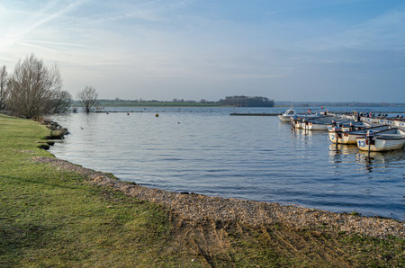 NORMANTON, UNITED KINGDOM - MARCH 20, 2015: Small wooden boats on Rutland Water, a reservoir in Rutland, England, UKのeditorial素材