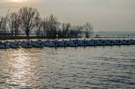 NORMANTON, UNITED KINGDOM - MARCH 20, 2015: Small wooden boats on Rutland Water, a reservoir in Rutland, England, UKのeditorial素材