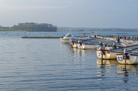 NORMANTON, UNITED KINGDOM - MARCH 20, 2015: Small wooden boats on Rutland Water, a reservoir in Rutland, England, UKのeditorial素材
