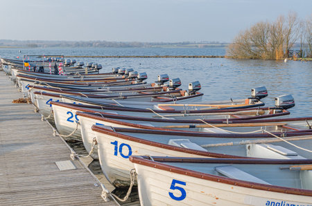 NORMANTON, UNITED KINGDOM - MARCH 20, 2015: Small wooden boats on Rutland Water, a reservoir in Rutland, England, UKのeditorial素材