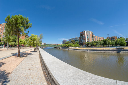 MADRID, SPAIN - AUGUST 23, 2015: The Principality of Andorra Bridge (known as the Y Bridge until 2011), pedestrian walkway in Madrid, Spain, designed and built as part of the Madrid RÃ­o Park project, inaugurated in 2009のeditorial素材