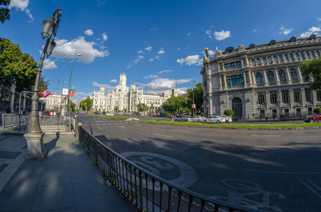 MADRID, SPAIN - AUGUST 16, 2015: View of Plaza de Cibeles in Madrid, Spain, with the headquarters of the Bank of Spain and the iconic Cibeles Palace; fisheye perspectiveのeditorial素材