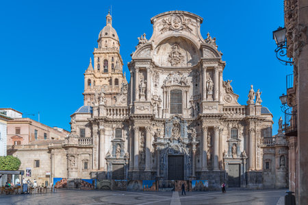 MURCIA, SPAIN - JANUARY 17, 2023: The Plaza del Cardenal Belluga, one of the most prominent urban spaces in the old town of Murcia, Spain, with the Cathedral Church of Saint Mary in the backgroundのeditorial素材