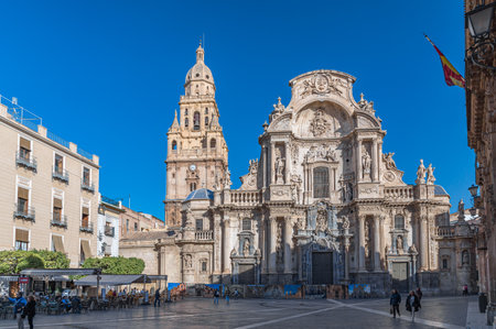 MURCIA, SPAIN - JANUARY 17, 2023: The Plaza del Cardenal Belluga, one of the most prominent urban spaces in the old town of Murcia, Spain, with the Cathedral Church of Saint Mary in the backgroundのeditorial素材