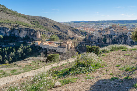 CUENCA, SPAIN - MARCH 28, 2015: Panoramic view of the Huecar Gorge with the town of Cuenca, Spain. In the foreground, the former Convent of San Pablo, since 1993 it houses a state-owned Parador hotelのeditorial素材