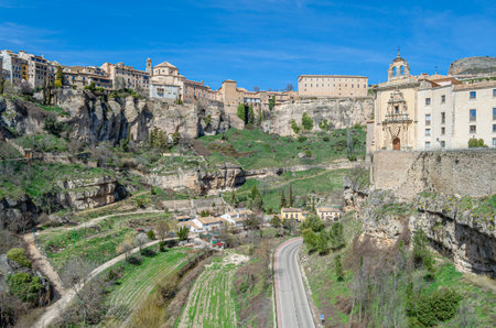 CUENCA, SPAIN - MARCH 28, 2015: Panoramic view of the Huecar Gorge with the town of Cuenca, Spain. In the foreground, the former Convent of San Pablo, since 1993 it houses a state-owned Parador hotelのeditorial素材