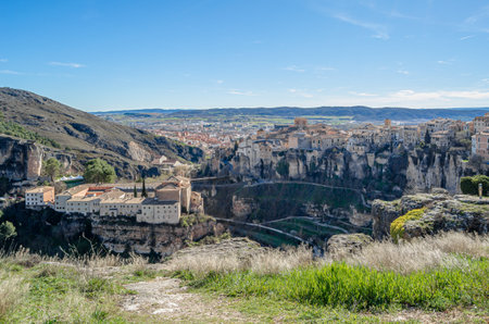 CUENCA, SPAIN - MARCH 28, 2015: Panoramic view of the Huecar Gorge with the town of Cuenca, Spain. In the foreground, the former Convent of San Pablo, since 1993 it houses a state-owned Parador hotelのeditorial素材