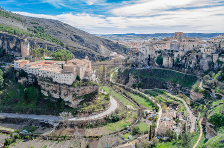 CUENCA, SPAIN - MARCH 29, 2015: Panoramic view of the Huecar Gorge with the town of Cuenca, Spain. In the foreground, the former Convent of San Pablo, since 1993 it houses a state-owned Parador hotelのeditorial素材