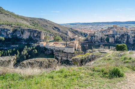 CUENCA, SPAIN - MARCH 28, 2015: Panoramic view of the Huecar Gorge with the town of Cuenca, Spain. In the foreground, the former Convent of San Pablo, since 1993 it houses a state-owned Parador hotelのeditorial素材