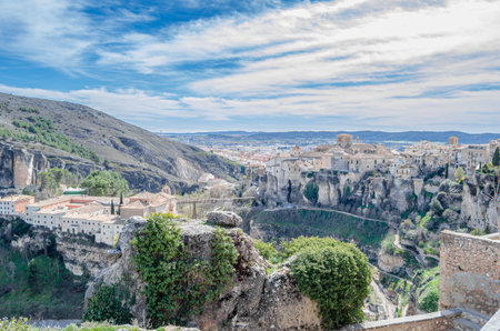 CUENCA, SPAIN - MARCH 29, 2015: Panoramic view of the Huecar Gorge with the town of Cuenca, Spain. In the foreground, the former Convent of San Pablo, since 1993 it houses a state-owned Parador hotelのeditorial素材