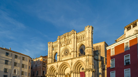 Dusk view of the Gothic Cathedral of Saint Mary and Saint Julian, with facade illuminated by warm...