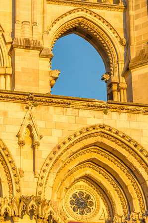 Dusk view of the Gothic Cathedral of Saint Mary and Saint Julian, with facade illuminated by warm light. It is a Catholic cathedral in the town of Cuenca, Castilla La Mancha, Spainの写真素材