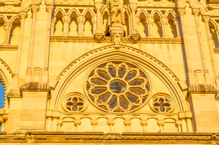Dusk view of the Gothic Cathedral of Saint Mary and Saint Julian, with facade illuminated by warm light. It is a Catholic cathedral in the town of Cuenca, Castilla La Mancha, Spainの写真素材