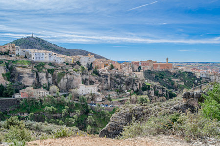 View of the Jucar Gorge and the town of Cuenca, Spain, a natural phenomenon caused by the erosion of the waters of this river on the limestone rock on which the city is built and which surrounds itの写真素材