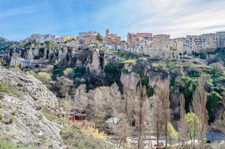 View of the Jucar Gorge and the town of Cuenca, Spain, a natural phenomenon caused by the erosion of the waters of this river on the limestone rock on which the city is built and which surrounds itの写真素材