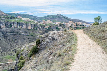 View of the Jucar Gorge and the town of Cuenca, Spain, a natural phenomenon caused by the erosion of the waters of this river on the limestone rock on which the city is built and which surrounds itの写真素材