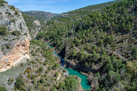View of the Jucar River in the Serrania de Cuenca Natural Park, Castilla la Mancha, Spain, an example of karst erosion on limestone rockの写真素材