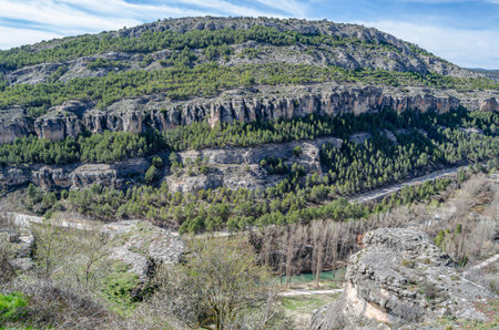 Landscape in the Jucar Gorge, near the town of Cuenca, Spain, a natural phenomenon caused by the erosion of the waters of this river on the limestone rockの写真素材